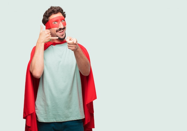 crazy man as a super hero making a phone call gesture or sign, with a proud, happy, satisfied look