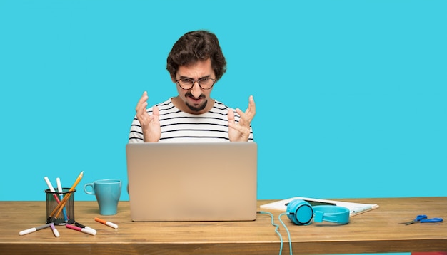 crazy man with laptop in disbelief