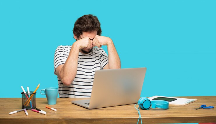 PSD crazy man with laptop in sad pose