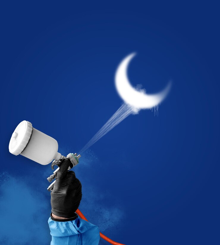 PSD a creative psd illustration of a hand using an air gun to spraypaint a white crescent moon against