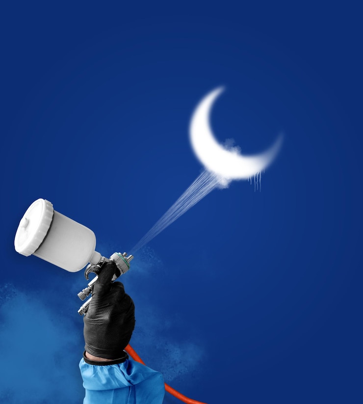 PSD a creative psd illustration of a hand using an air gun to spraypaint a white crescent moon against