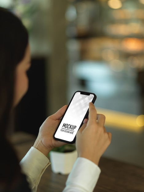 Cropped shot of businesswoman using smartphone mockup