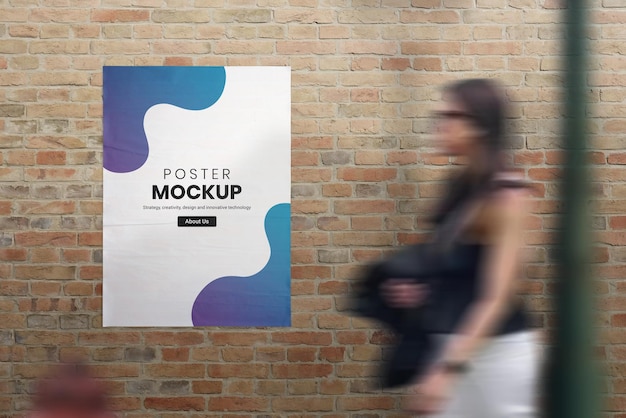 PSD crumpled poster on street brick wall mockup