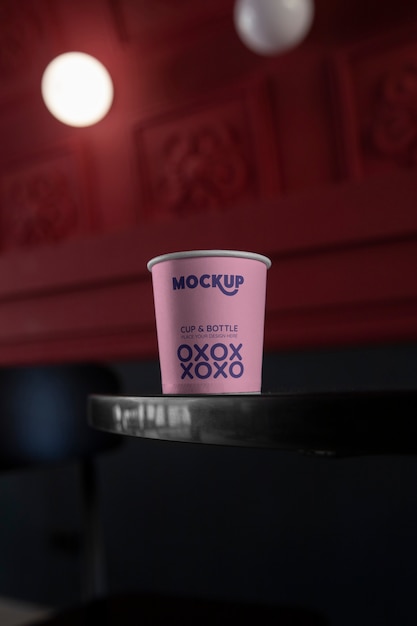 PSD cup mockup in public space