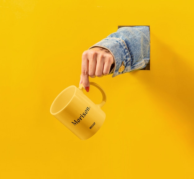 Cup with hand mockup