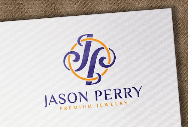 Debossed full color logo mockup on white textured paper