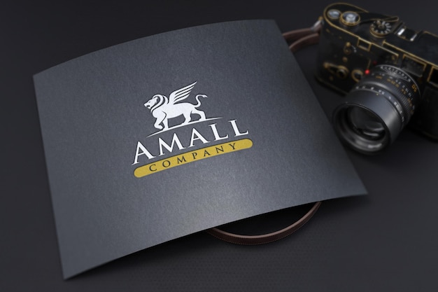 PSD debossed logo mockup on textured black paper