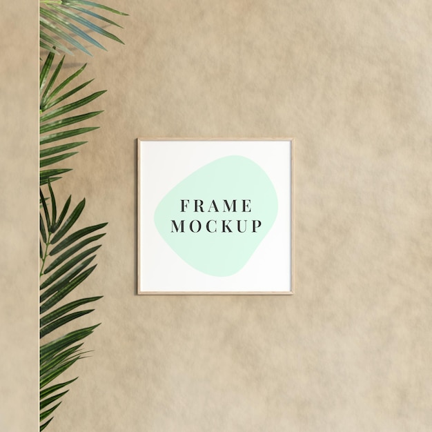 Decoratief leeg frame mockup hangend aan de muur met plant in minimalistische kamer