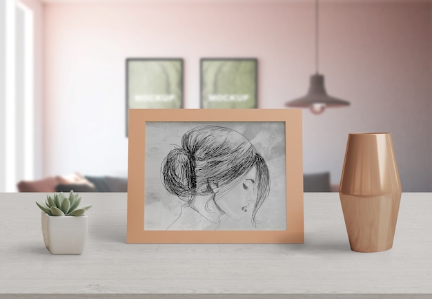 Decorative frame mockup on table at home