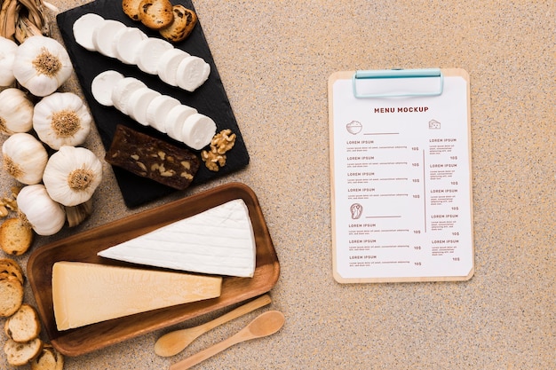 Delicious food assortment with clipboard mock-up