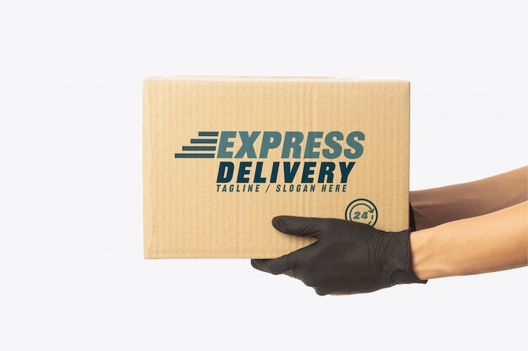PSD delivery man hand holding cardboard boxes mockup