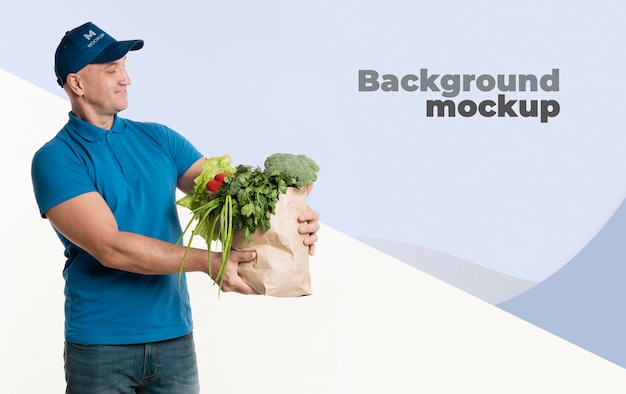 PSD delivery man holding a bag with groceries