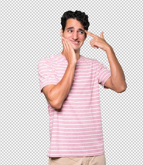 depressed young man making a suicide gesture