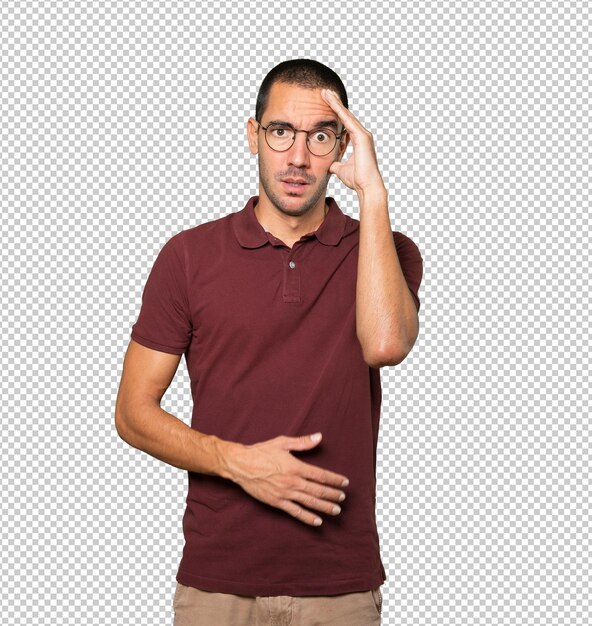 Depressed young man posing against background