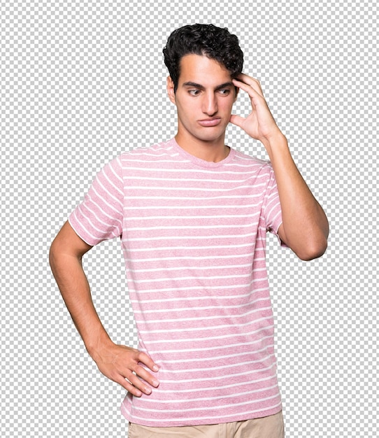 Depressed young man posing against background