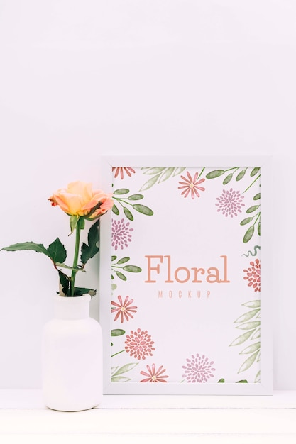 Desk composition with flower decor and frame mockup