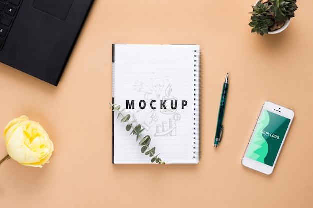 Desk concept with plants and notebook