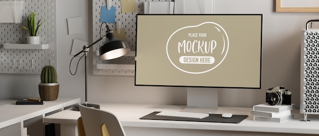desktop computer monitor in white empty screen with decor in work space modern apartment
