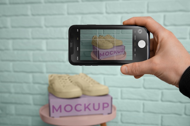 PSD device taking picture of shoes mockup