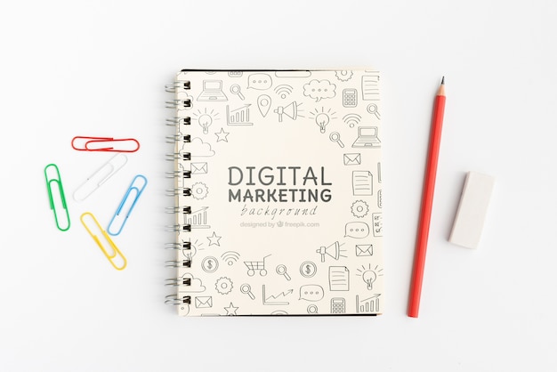 PSD digital marketing doodle notepad with pencils top view