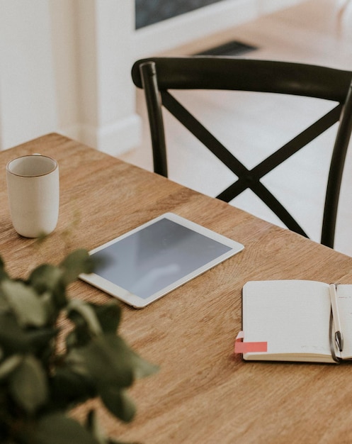 PSD digital tablet mockup on the wooden table