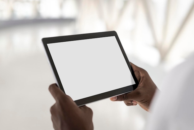 digital tablet screen mockup psd in the hands of a man