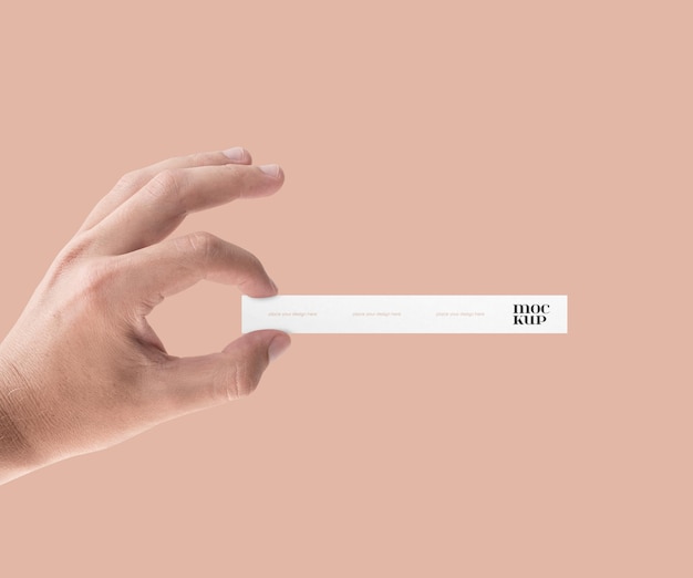 Disposable perfume test strip in hand mockup psd template