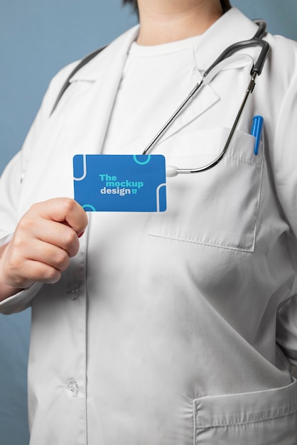 PSD doctor holding business card side view