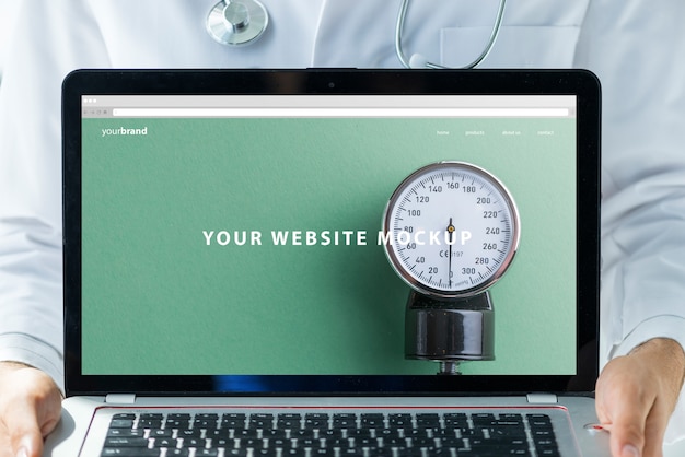 Doctor holding laptop mockup for website