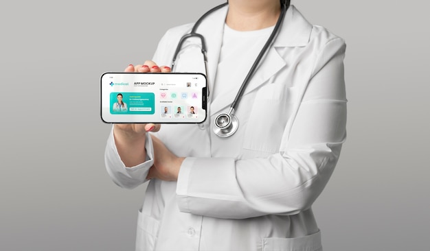 Doctor holding smartphone side view
