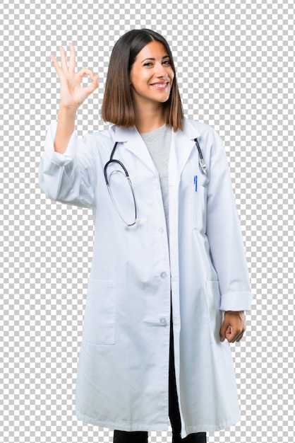 Doctor woman with stethoscope showing an ok sign with fingers. Face of happiness and satisfaction