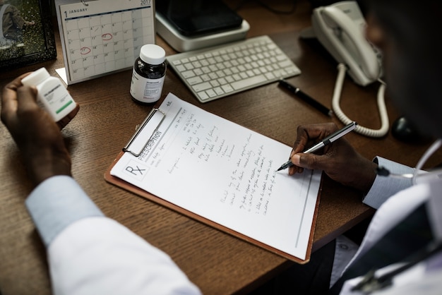 A doctor writing a prescription