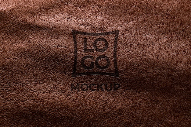 PSD dramatic warm light over leather logo mockup