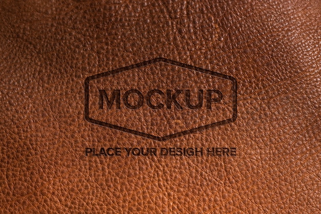 PSD dramatic warm light over leather logo mockup