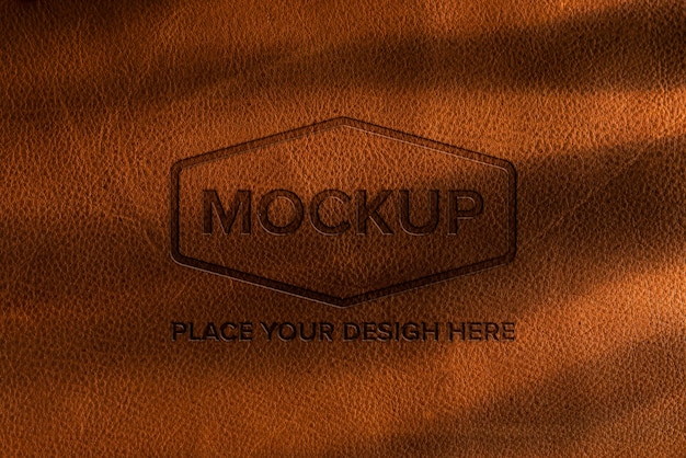 PSD dramatic warm light over leather logo mockup