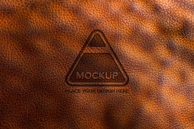 PSD dramatic warm light over leather logo mockup