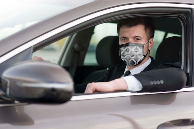 Driver with fabric mask on face