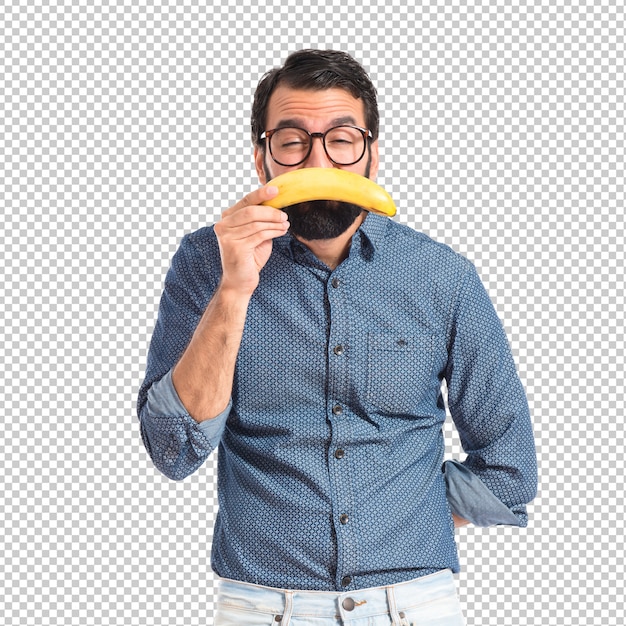 Droevige jonge hipstermens met banaan