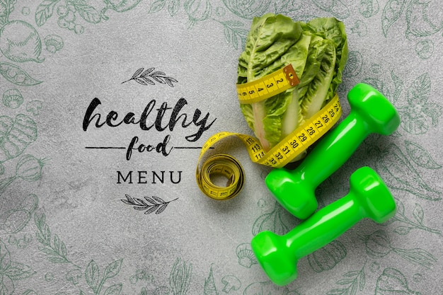 Dumbbells and salad with healthy food menu concept