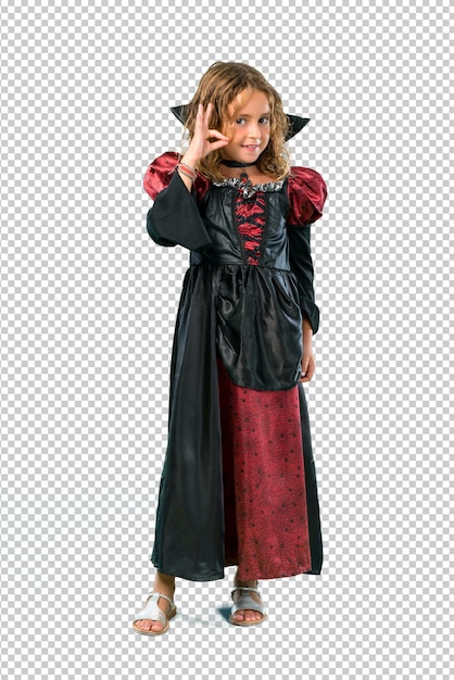 Dzieciak ubierał jako wampir przy Halloween wakacjami pokazuje ok znaka z palcami