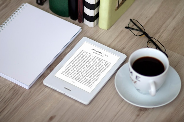 E-book reader, mock-up with coffee cup, library, notebook, books and glasses