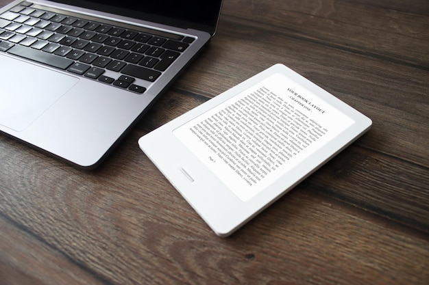 E-Book Reader Mock-Up with laptop, wood background