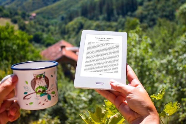 E-book reader, mockup with coffee mug