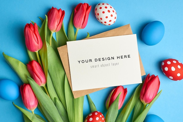 Easter holiday greeting card mockup with colored eggs and red tulip flowers