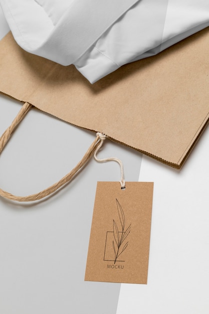 eco-friendly price tag and paper bag with formal shirt mock-up