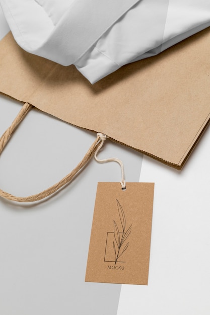 Eco-friendly price tag and paper bag with formal shirt mock-up