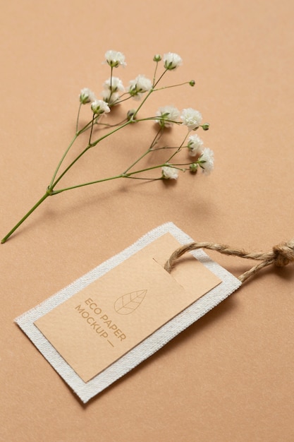 PSD eco paper label mock-up with baby's breath flowers