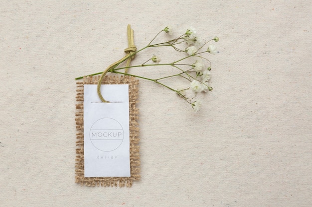 PSD eco paper label mock-up with baby's breath flowers