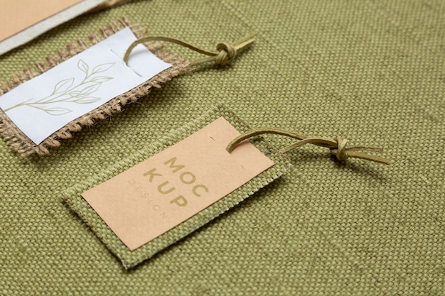 Eco paper labels mock-up on burlap textile