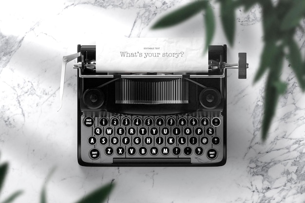 PSD ediatable typewritter with green leaves psd mockup